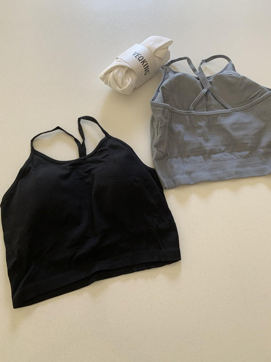 Three VEQKING black tank tops laid flat, showing fit, fabric, and style details.